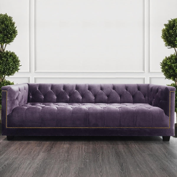 Earl sofa upholstered in a muted purple mauve, combining softness with subtle sophistication.