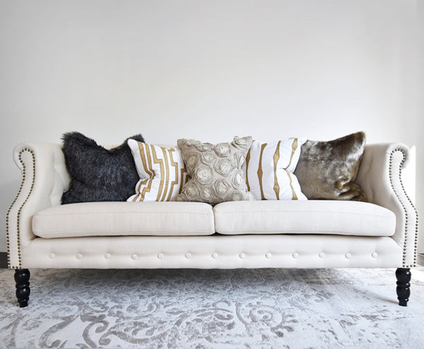 Cushions combination of beige and ivory gold.