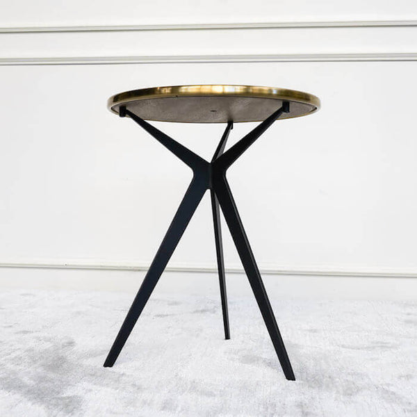 Close up view of end table, Brushed stainless steel table top with lacquer finish, Steel legs in black powder coated finish.