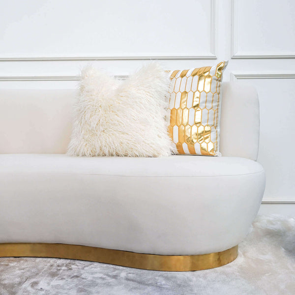 Close up look of the easy clean velvet fabric in ivory, styled with the Gabbana geometric cushion and furfur ivory down feather pillows.