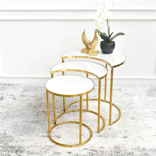 Made with cultured marble table tops, this Eden Gold Marble Nesting Tables Set of 3 nesting tables creates extra storage for snacks and refreshments when you entertain, and is also ideal to showcase your decor, small plants, and books.