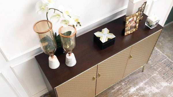 Top view of Elize cabinet, with walnut veneer and champagne gold doors. 