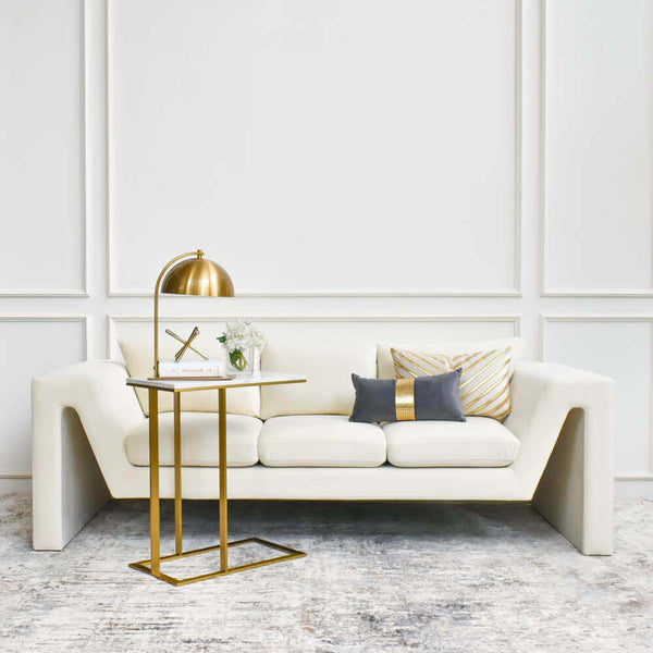 An eye-catching design with a Mid-Century Modern vibe, this streamlined sofa anchors your living room in an understated yet bold statement style.