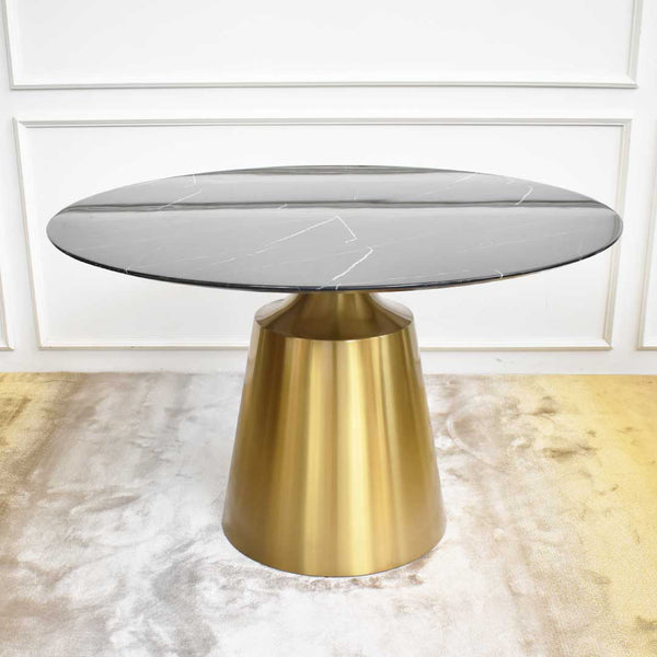 Emma round dining table in a black cultured marble finish, synthetic stone, stainless steel brushed gold base.