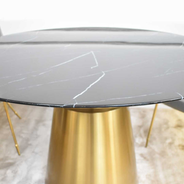 Close up side view of Ivory veins and grains of the Black Emma dining table.