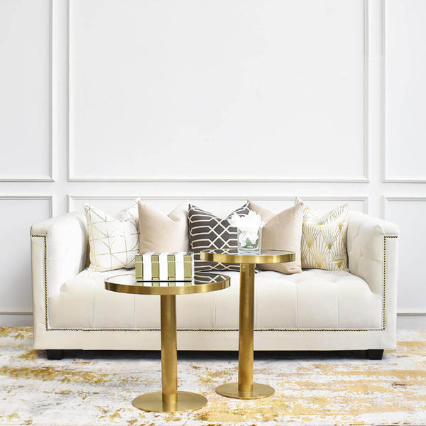 Add cushions with soft tones such as white, beige and gold to your ivory sofa to brighten your whole look. 