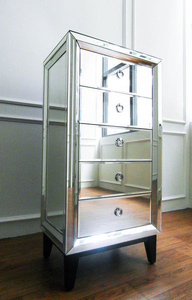 Etienne 5-Drawer Tall Boy Dresser is made using all-hand-cut mirrors and reflects sunlight beautifully in a bedroom.