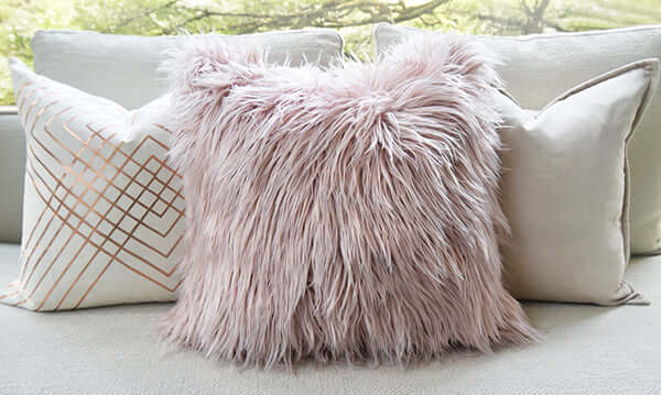 Shaggy Faux Fur Cushion with ivory and gold cushions.