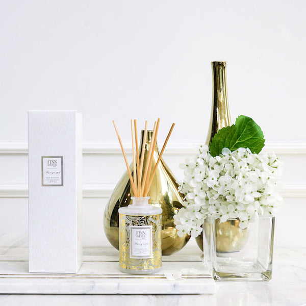 Double up your diffusers as a decor piece as well with Finn Avenue's Reed diffuser white and gold themed glass bottle.