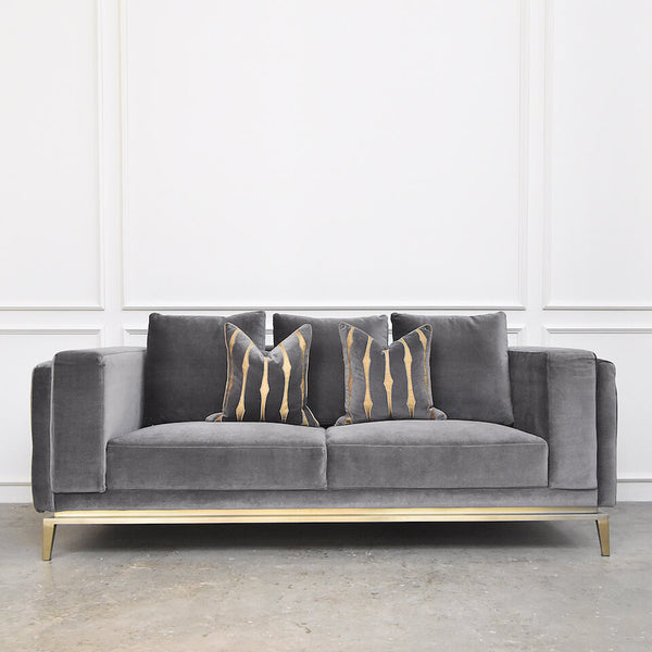 Modern 3-Seater Sofa in Smooth and Soft Grey Velvet. Pair this sofa with grey cushions with a hint of gold to accentuate the stainless steel gold frame.