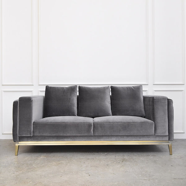 Fitzgerald Sofa, A simple yet grand sofa. Built on a matte gold stainless steel bar, the sturdy legs and arm rests make an impressive sofa architecture.