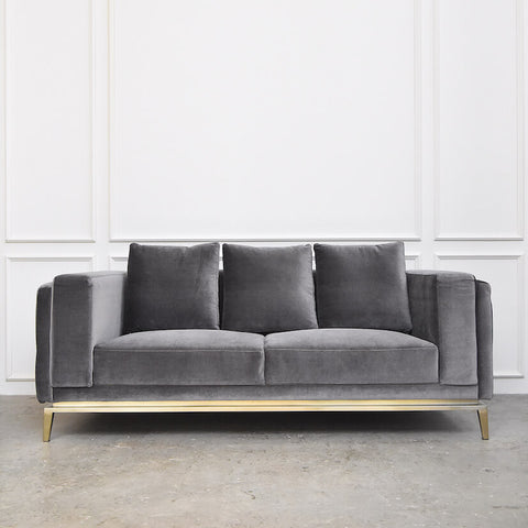 Fitzgerald Sofa, A simple yet grand sofa. Built on a matte gold stainless steel bar, the sturdy legs and arm rests make an impressive sofa architecture.