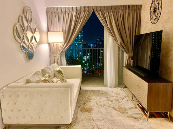 Ivory cream Fitzgerald sofa paired with Elize TV console, styled in a compact yet grand apartment.