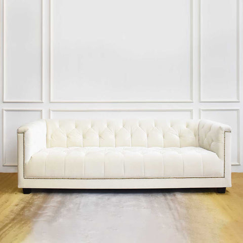 Modern and smooth luxurious Ivory velvet on Chesterfield sofa design.