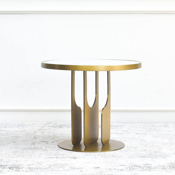 Crafted in artistically sculptured legs, Hilltops Round Marble Coffee Table’s glamorous stainless steel gold finish showcases an openwork, angular design which is inspired by the ever-so-popular Modern Art Deco Design.