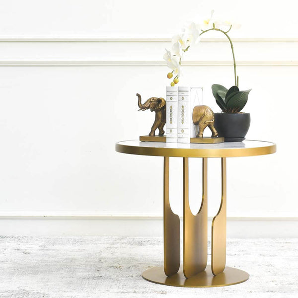 Hilltops marble coffee table, made small for modern living room space, is decorated with bookend and orchid with vase.