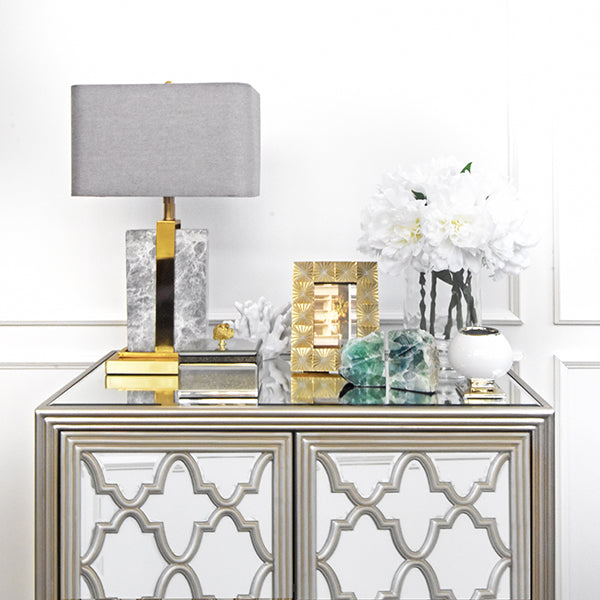 Entryway console table decor on top of Iberian cabinet.