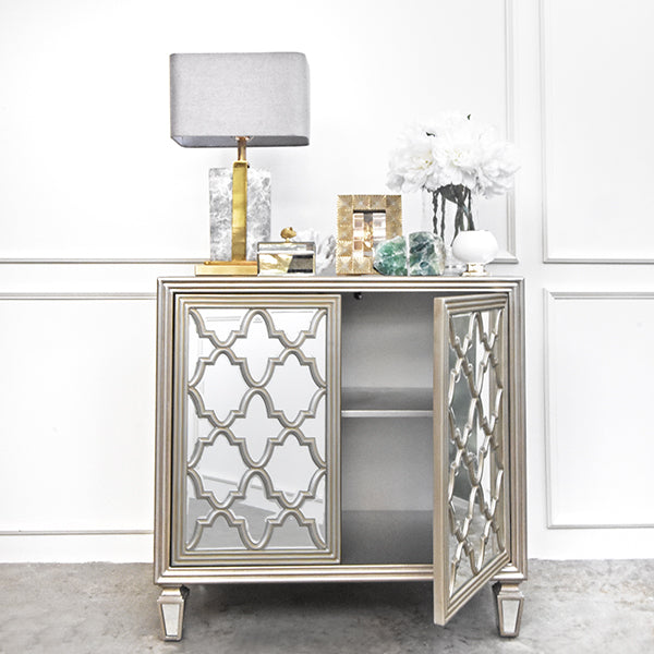Storage space for mirrored moroccan sideboard.
