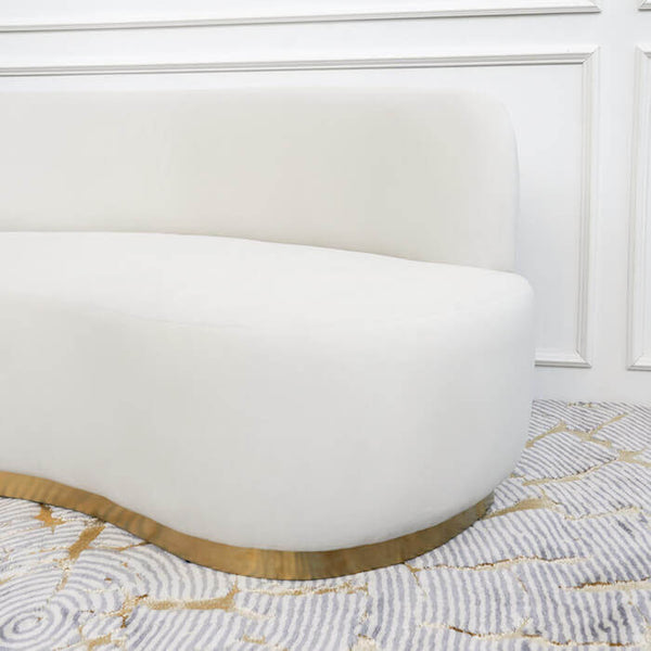 Side view of plush Infiniti sofa seats with curved edges, add a textured rug for a modern look.