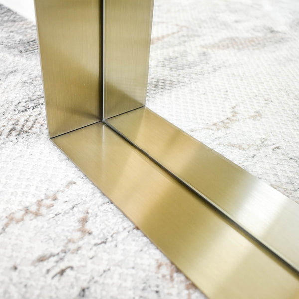 Contemporary full-length mirror with a narrow brass frame and clean, minimalistic lines, suitable for versatile orientation.