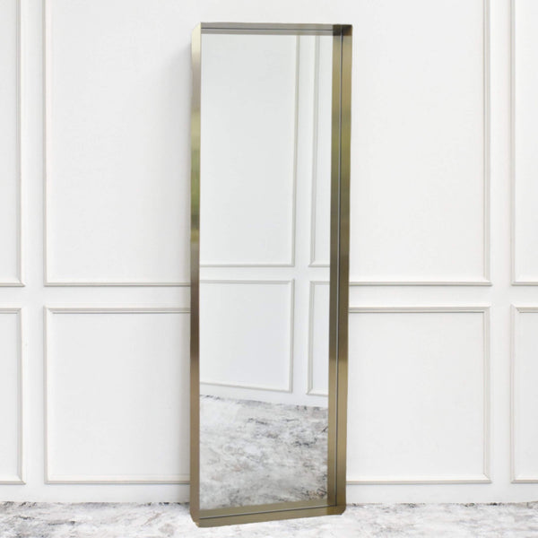 Full-length mirror with a slim brass-finished stainless steel frame, designed for vertical or horizontal wall hanging.