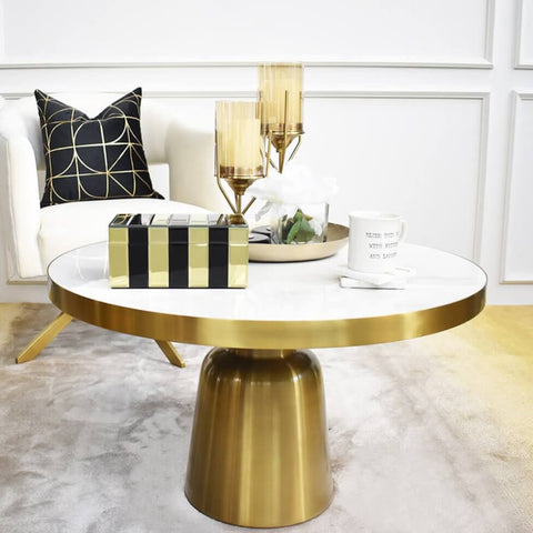 Louis Carrara coffee table, style your living room up with black and gold accessories to match the gold coffee table.