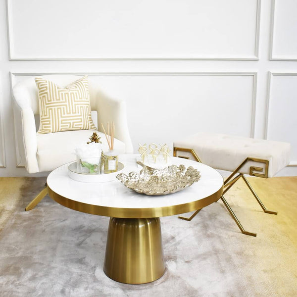 The Marq crossed vanity stool makes a luxurious addition to your living room corner, alongside the Louis marble coffee table and the Tourner armchair. 