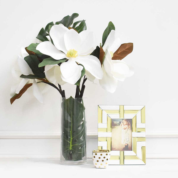 Kassie Mirrored Photo Frame decorated with Magnolia White Flowers in Vase.