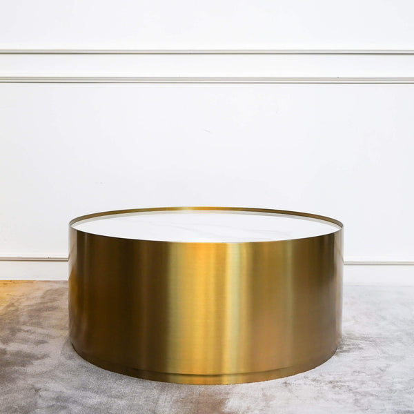 Marc Modern Art Deco Gold Coffee Table  with White Carrara Marble inset Gold Drum Base displayed at Finn Avenue Furniture Store Singapore.