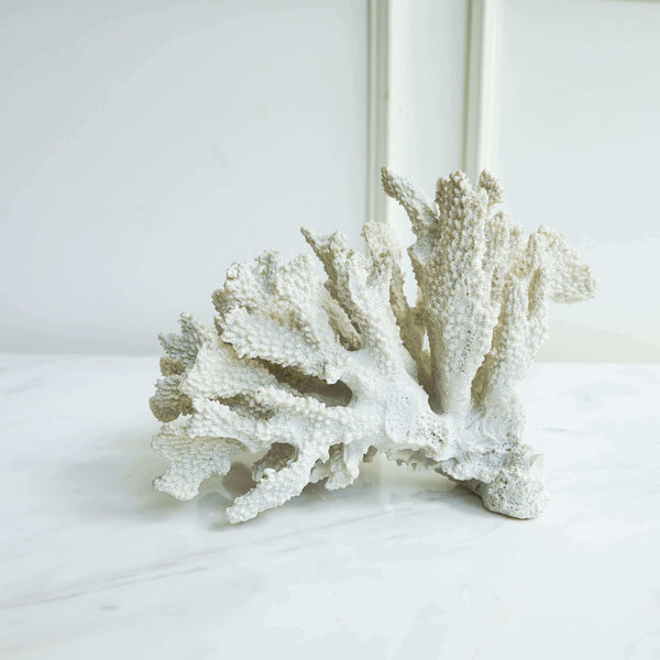 Maurel white faux coral decor sculpture is the perfect nautical shelf decor piece that would be sure to fascinate guests with a coastal vibe.