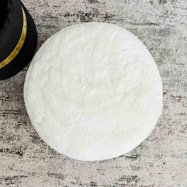 Mercier Ottoman Collection showcases this Mercier Vanity Stool Ottoman in white faux fur.