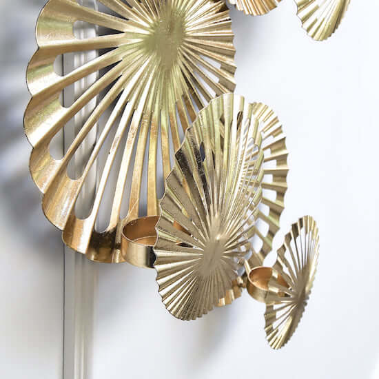 Metal Gold wall art sculpture, flower-like round discs.