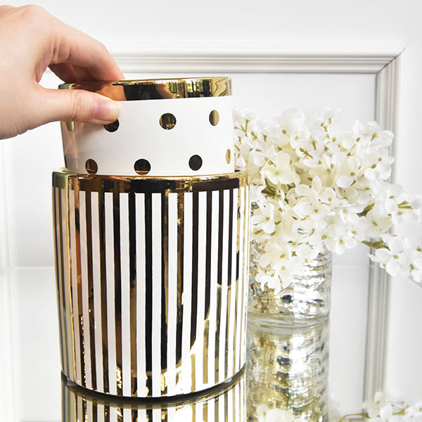 Stackable jars in gold trimming.