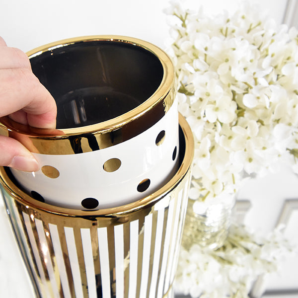 Stackable planters in gold designs.