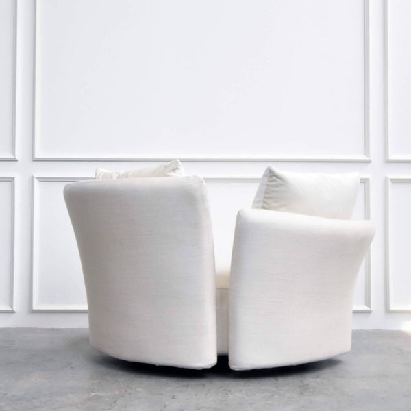 Round Sofa with a pair of "Spilt-Backing" is coupled with two back pillows for decor. A beautiful round sofa in a Modern Lucury Living Room.