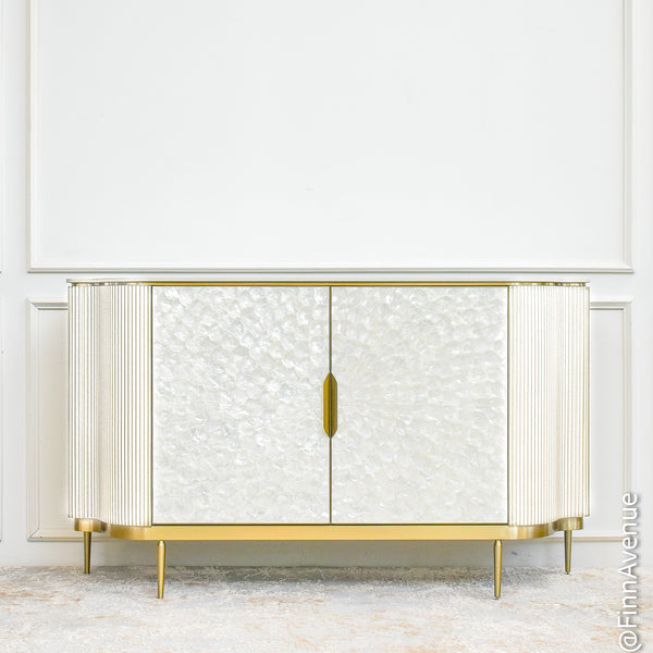 Elegant Champagne Gold Perla sideboard with hand-crafted mother-of-pearl doors, gold details, and contemporary coastal design.