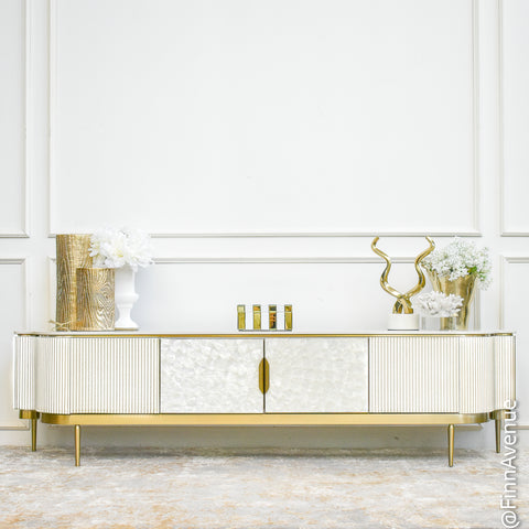 Front view of the Perla 4-Door TV Console in Ivory White, showcasing mother-of-pearl inlay panels, slate top, and curved gold-accented sides.