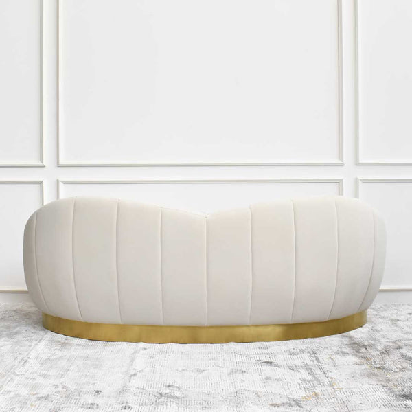 Back view of the Primrose curved sofa, featuring a backrest that dips lower in the center, creating an enveloped feel.