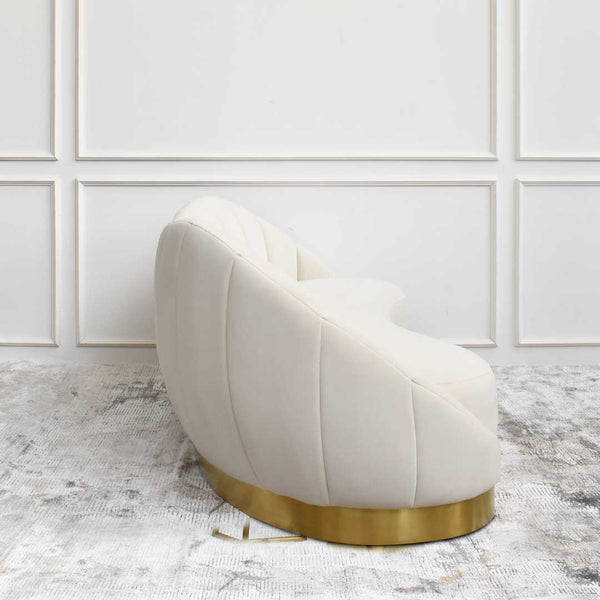 Curved sofa creates a petite and slim look in your living room space, highlighting a feminine and soft look.