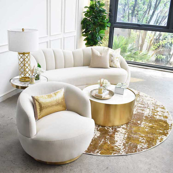 Ivory and gold themed living room, Primrose sofa, Cristian marble side table, Infiniti armchair, Marc white coffee table, Emilien round rug.