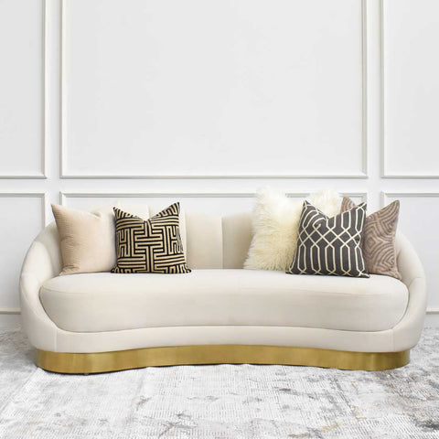 Plush and comfy, the primrose curved sofa features a dipped backrest that goes from high to low, versatile and comfortable. Fluffy pillows complete the luxurious living room look.
