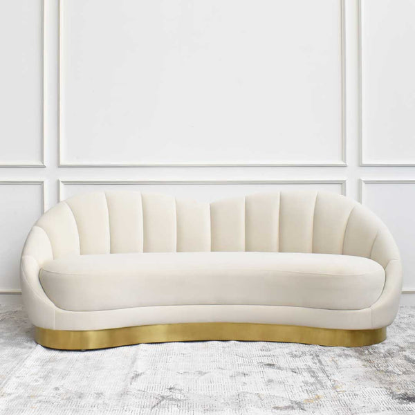 The Primrose Curved sofa exudes old Hollywood glam with its ivory and gold design, the clam like contours on the curved backrest adds a glamorous touch.