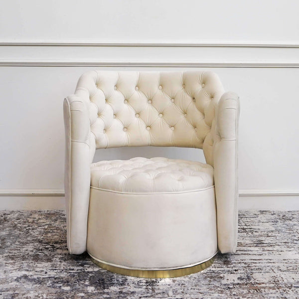 Ivory cream velvet armchair with stainless steel brushed gold swivel base.