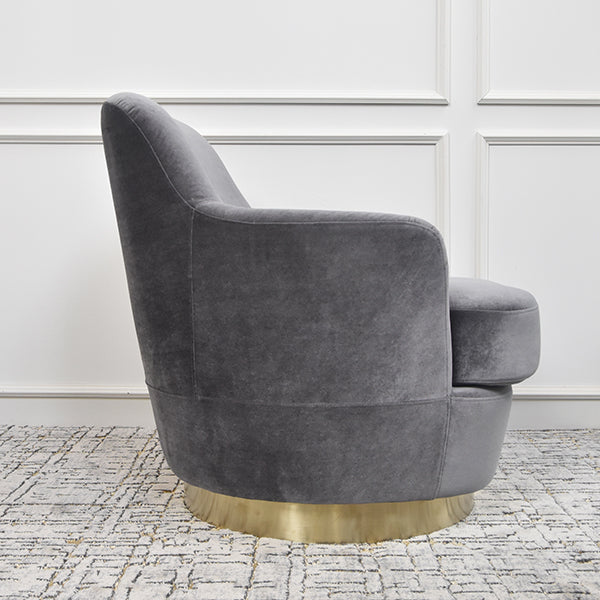 Side view of the dark grey hues velvet material of the Rever armchair.