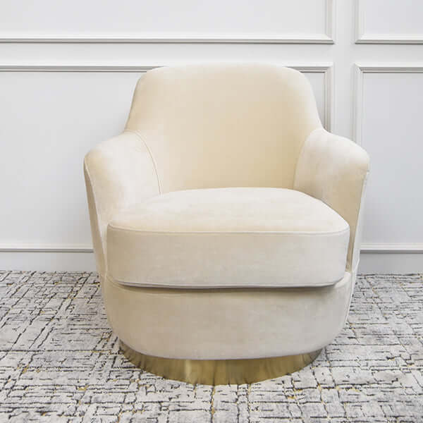Front view of the Rever Armchair featuring plush cushioning, slim armrests, and smooth velvet upholstery.