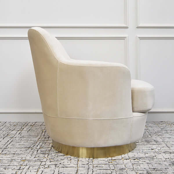 Alternate side view of the Rever Armchair showing the elegant arm profile and soft velvet texture on a solid frame.