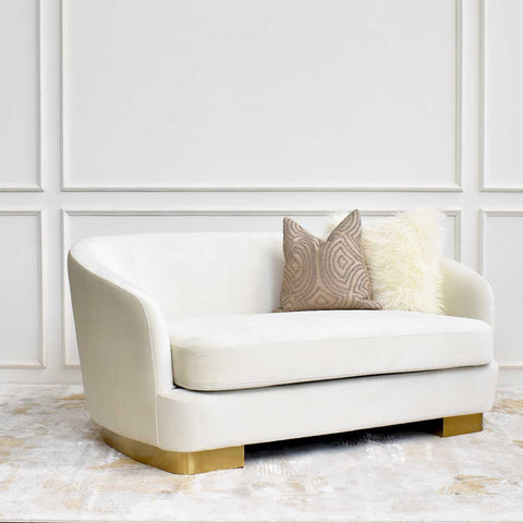 A Petite 2 seater Rever Curved sofa, with deep seating depth for laid back comfort in creamy ivory velvet.