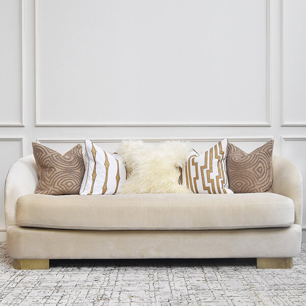 Add a touch of luxurious glamour to the Rever sofa with the furfur ivory cushions centered in your sofa. 