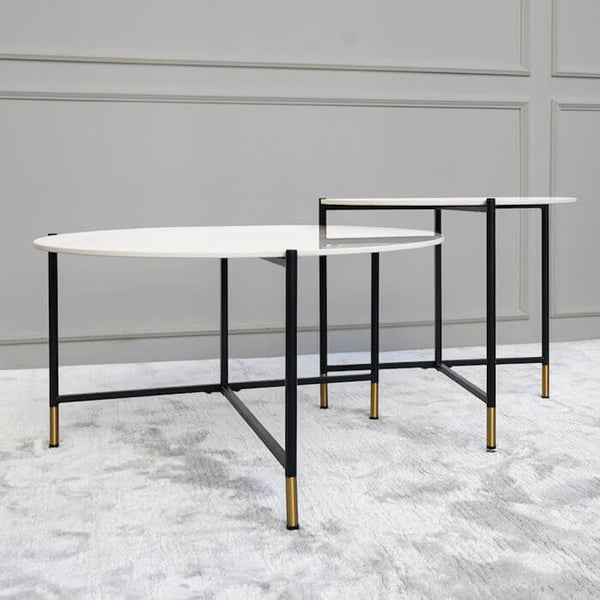 Crossed powder coated black legs creates a contrast with the Carrara cultured marble top, a touch of gold at the feet for a classic look.