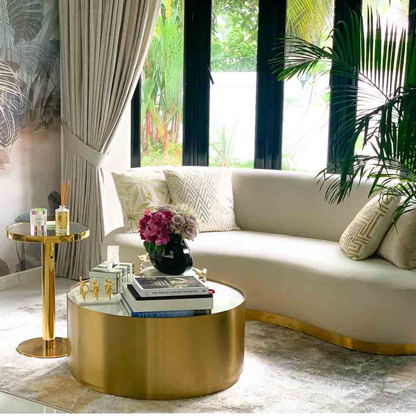 Interior of a Luxury luxury condo of a famous socialite in Singapore, showcasing the contemporary Eclipse Curved Sofa, Marc Carrara Coffee Table, and Vis-a-vis Coffee Table, and our exclusive throw cushion collections, designed for those seeking high-quality and affordable luxury furniture.